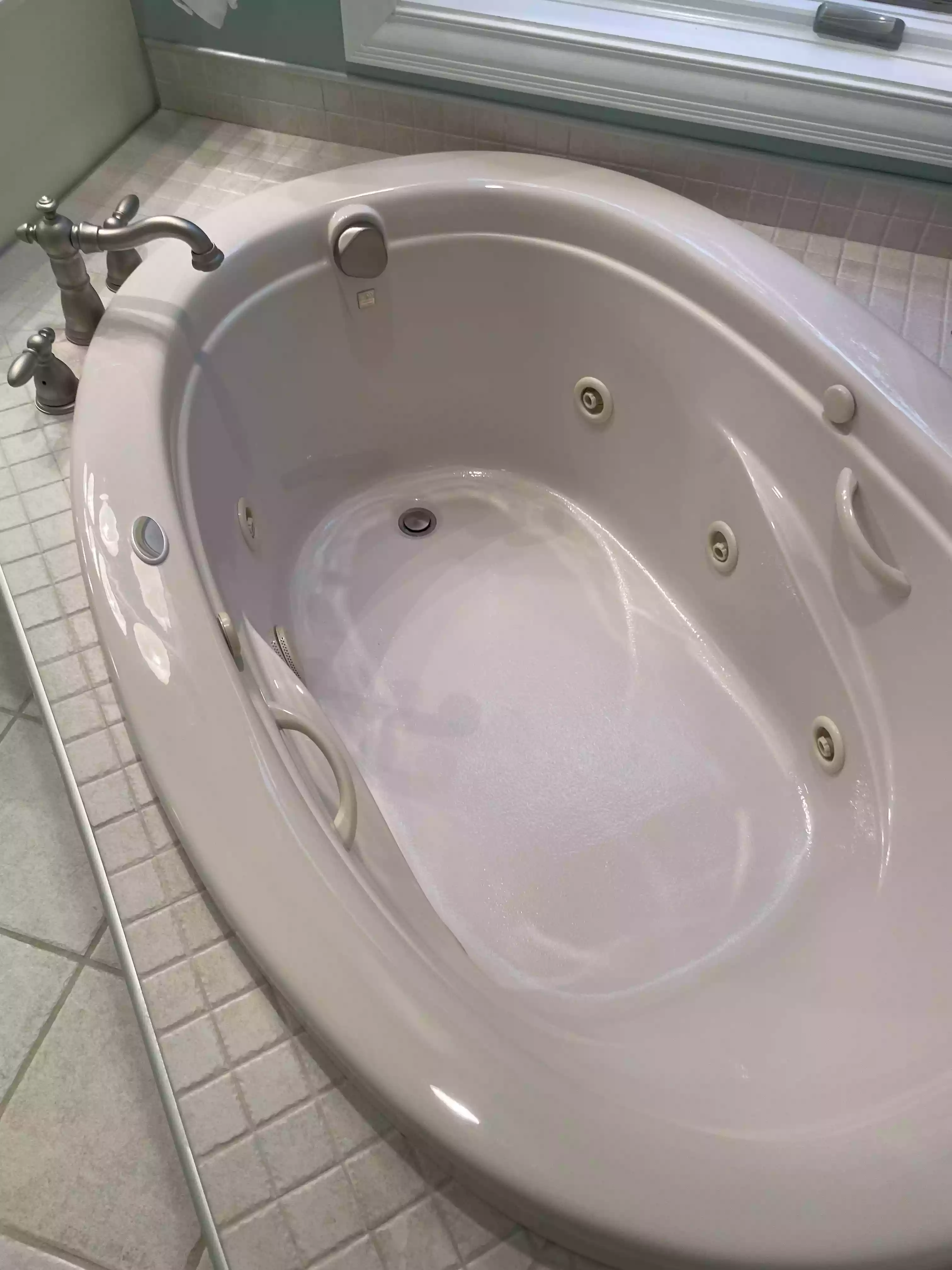 a sparkling clean jetted soaking tub